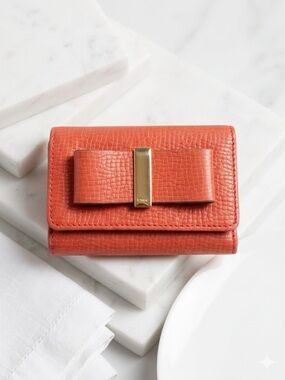 Chloé Bobbie Bow Tri-Fold Wallet Orange Pebbled Leather Gold Accent